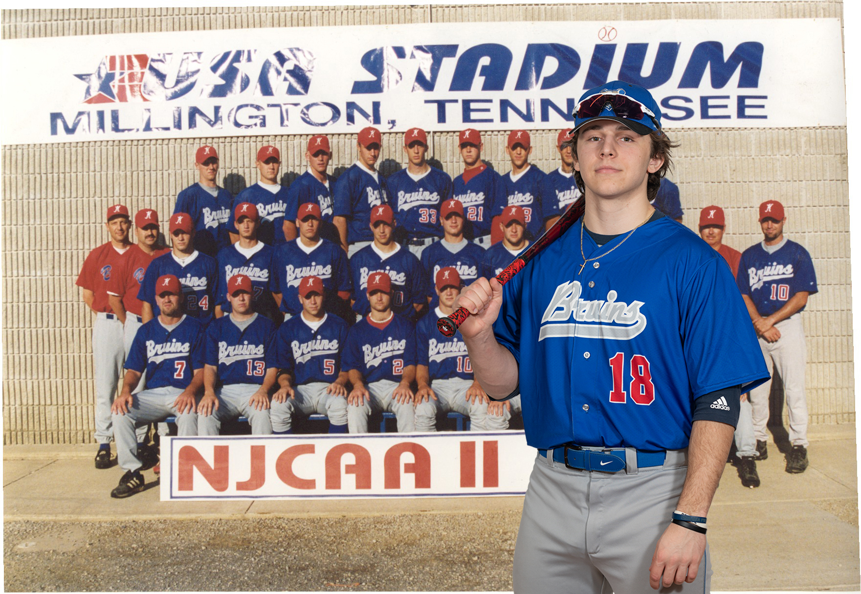 A KCC baseball player stands in front of a photo of the 1999 KCC baseball team.