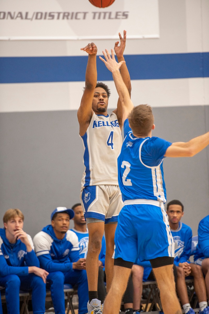 Men's basketball players compete during a home game.